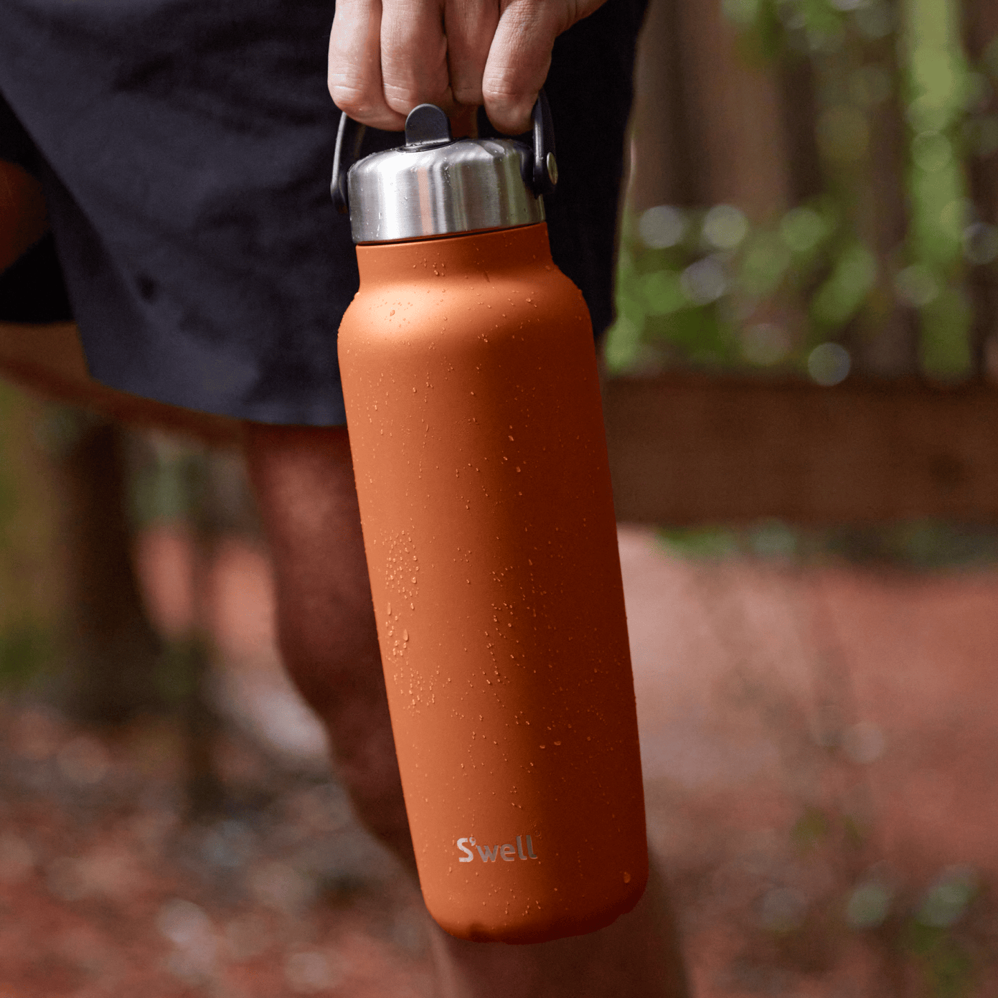 explorer-with-flip-straw-lid-40oz-q3 Swell-Explorer-Water-Bottle-40oz-Orange-Carnelian-LifeStyle.png